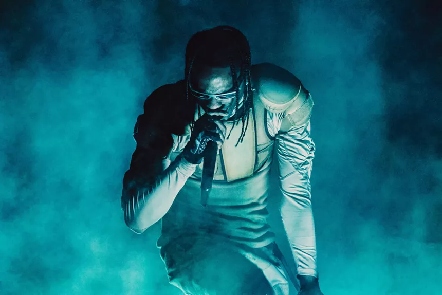 Travis Scott performing at the Kaseya Center