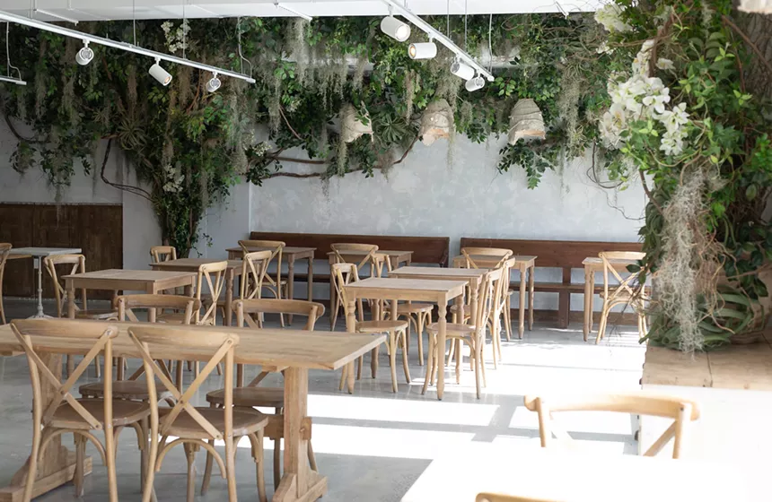 A dining room with plants