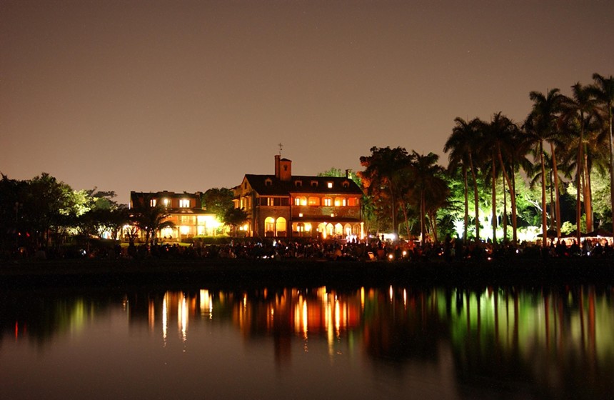 The Deering Estate reflecting on a lake at night