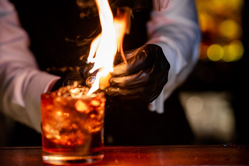 A cocktail with fire