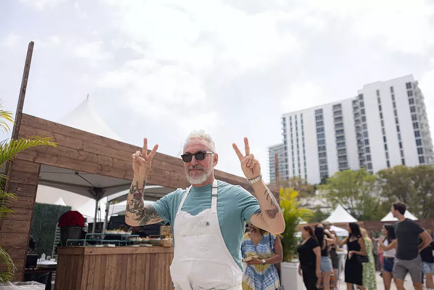 A man holding two peace signs