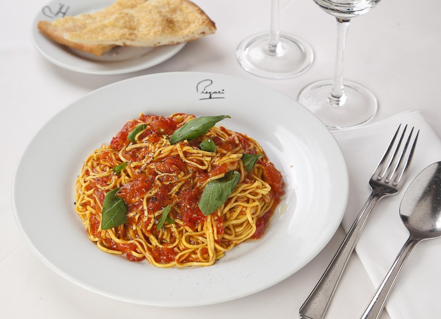 A spaghetti pasta dish on a white plate