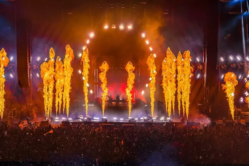 Pyrotechnics shot from the stage as two DJs perform