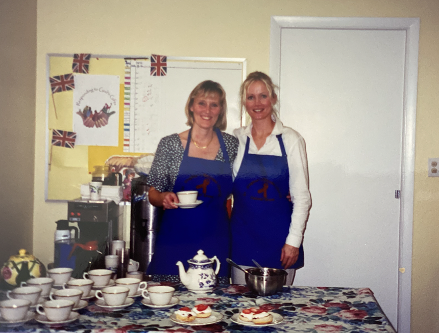 Two women with blue aprons