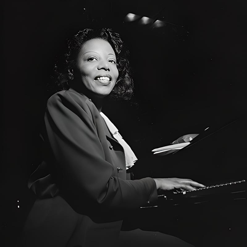 Black and white photo of Mary Lou Williams at the paino
