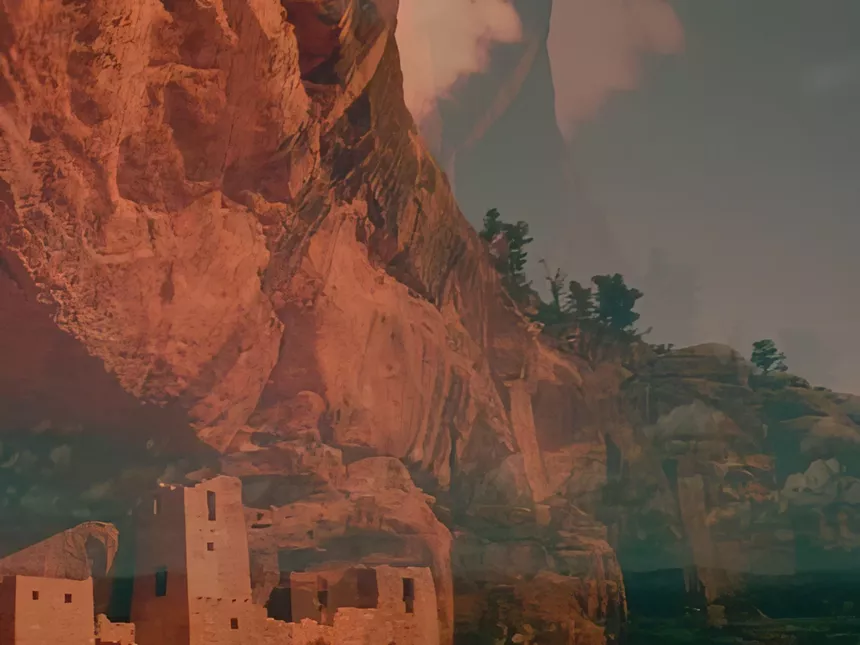 Red dessert cliffs and ancient dwellings below