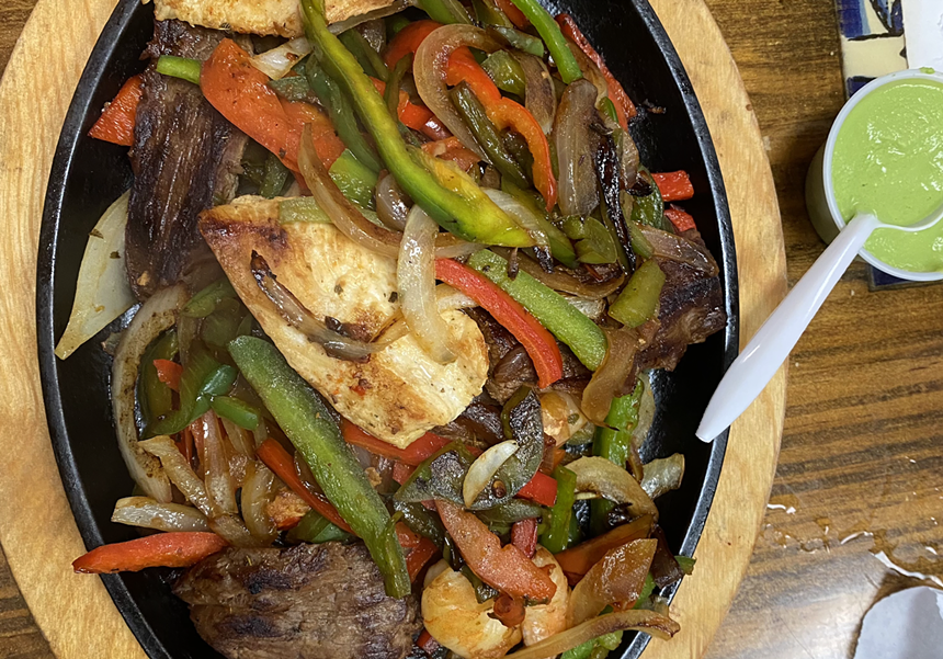 Fajitas on a black griddle