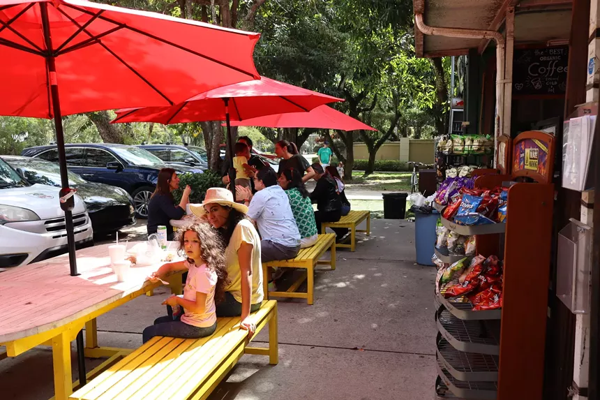 Customers sitting at outdoor tables