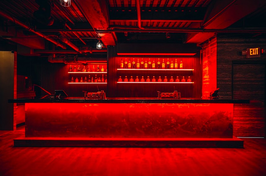 The basement space at Mode awash in red light
