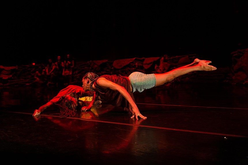 Aeon de la Cruz performing on stage with a partner