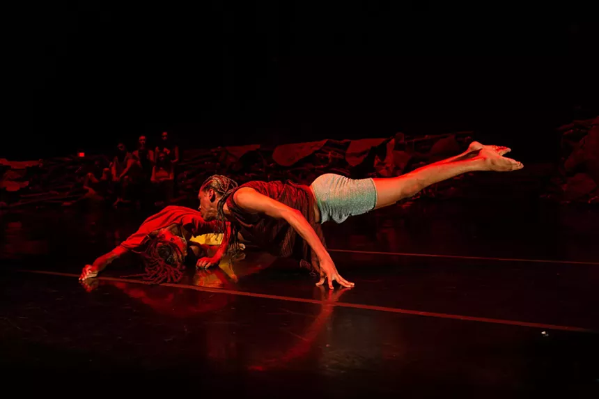 Aeon de la Cruz performing on stage with a partner