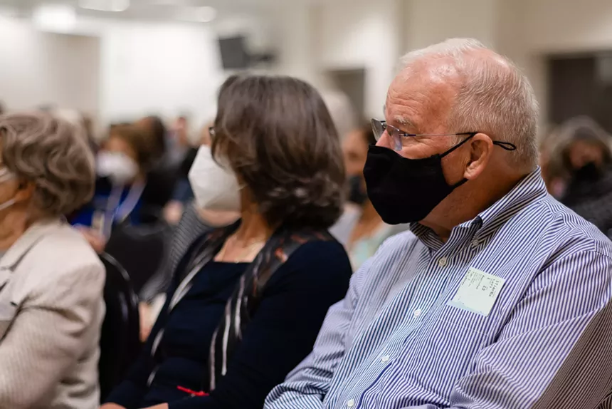 Two older attendees at a Classical Conversations lecture