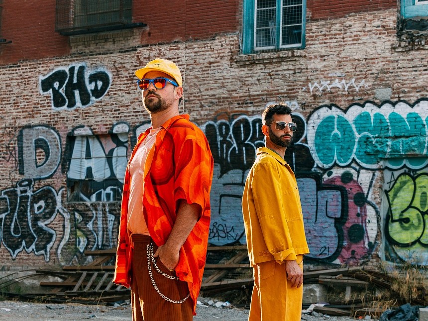 Soul Clap's Charles Levine and Eli Goldstein standing in front of a graffiti-strewn wall