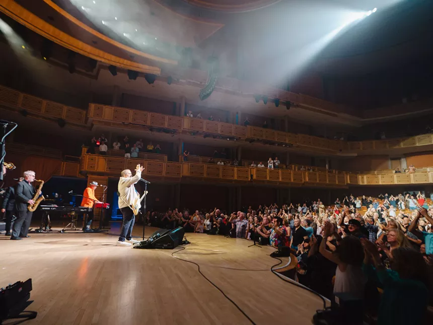 shot in profile, Raul Malo exhorts the audience at the Adrienne Arsht Center for the Performing Arts in Miami