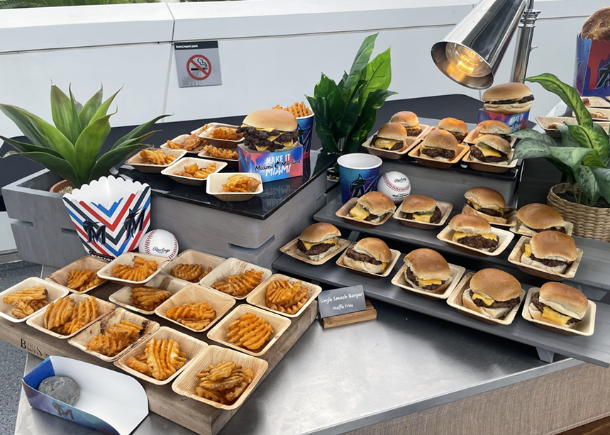 burgers and fries on serving trays