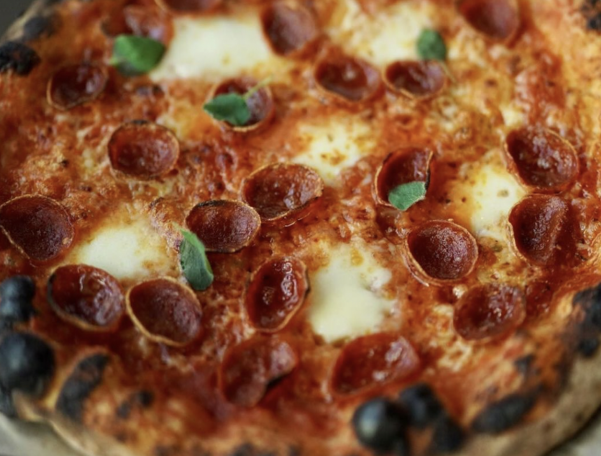 A close up of pepperoni pizza