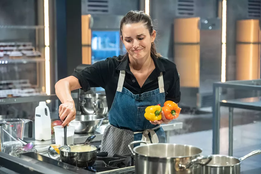 A woman cooking with an apron