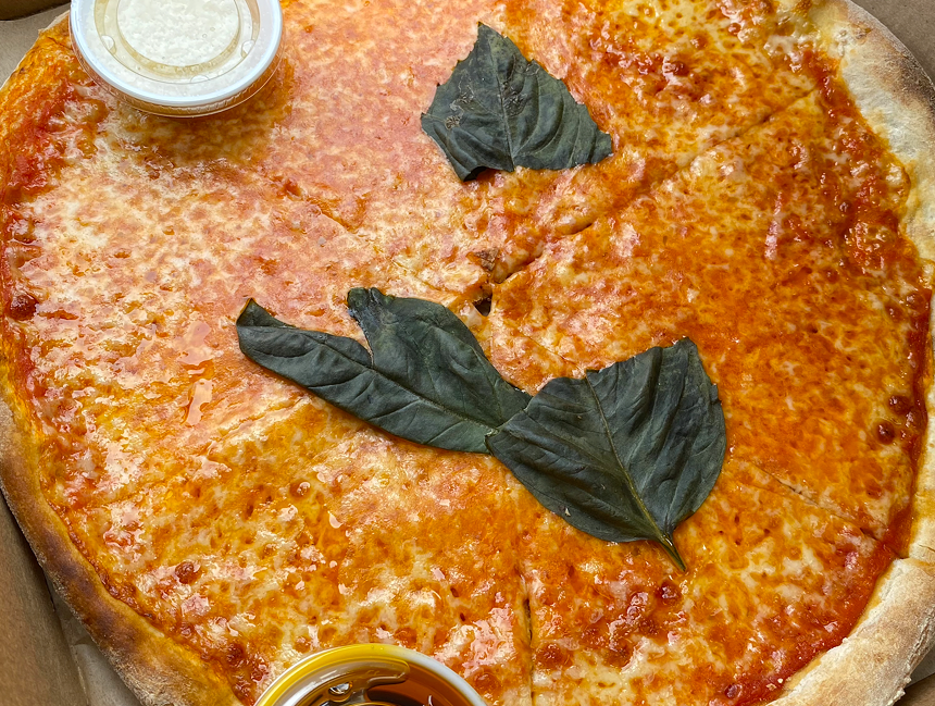 A close up of a cheese pizza