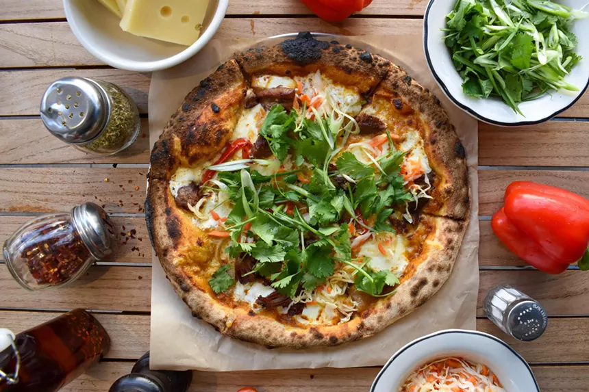 A pizza with toppings