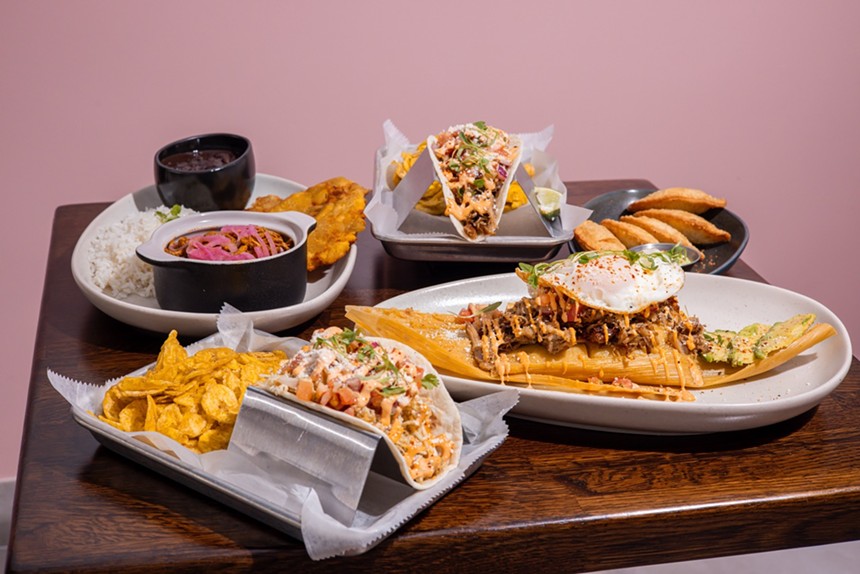 Food on trays with pink background