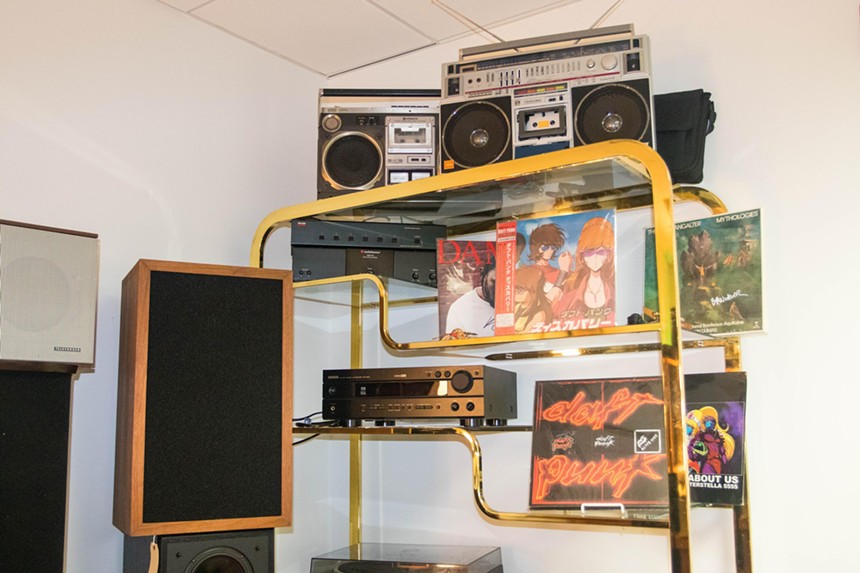 Vintage audio equipment and Daft Punk records on a shelf at Fruit Fly Records