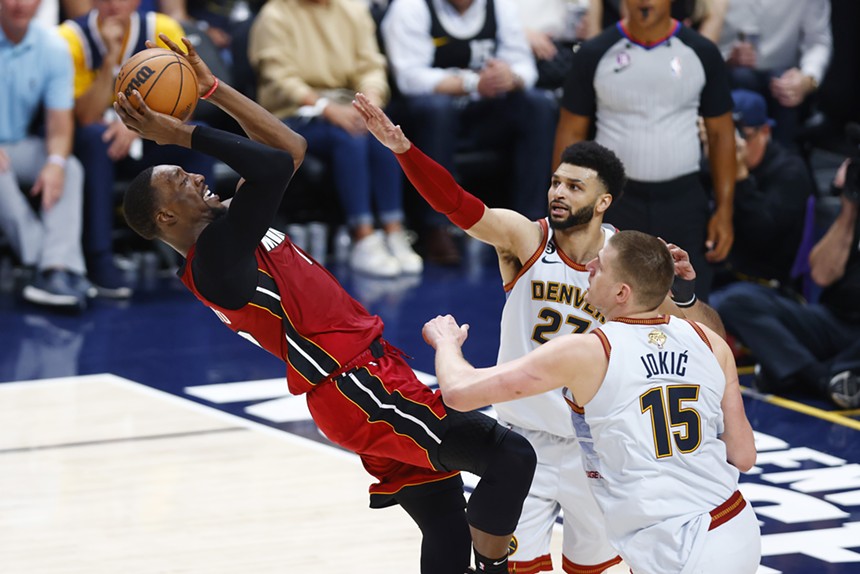 Bam Adebayo shoots over Jamal Murray and Nikola Jokic of the Denver Nuggets during the Game Five of the 2023 NBA Finals on June 12, 2023 in Denver, Colorado.