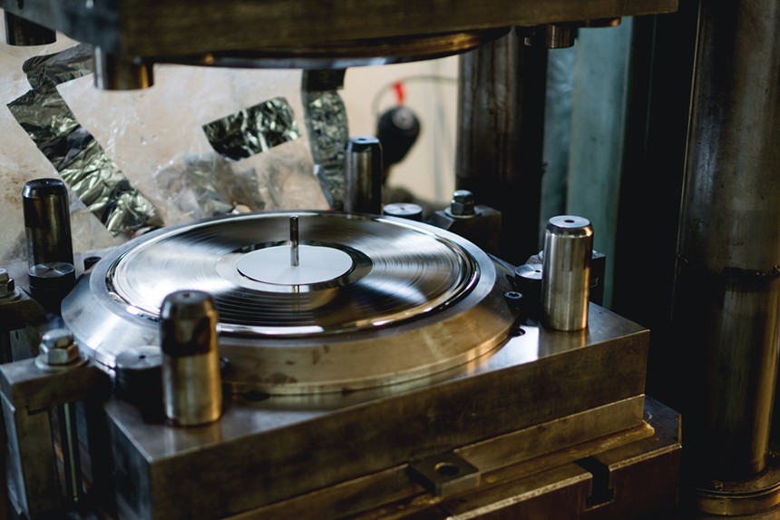 A record being pressed in a factory