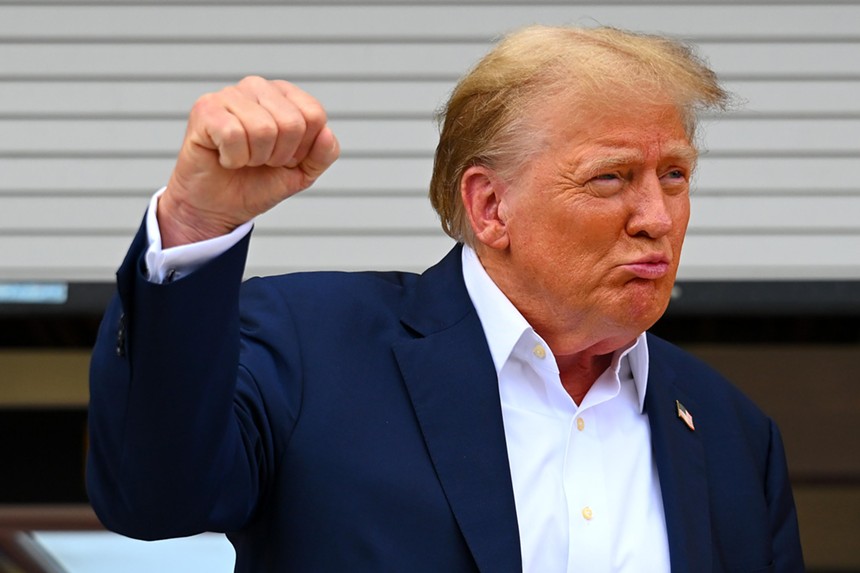 Donald Trump flashes his signature fist-pump gesture
