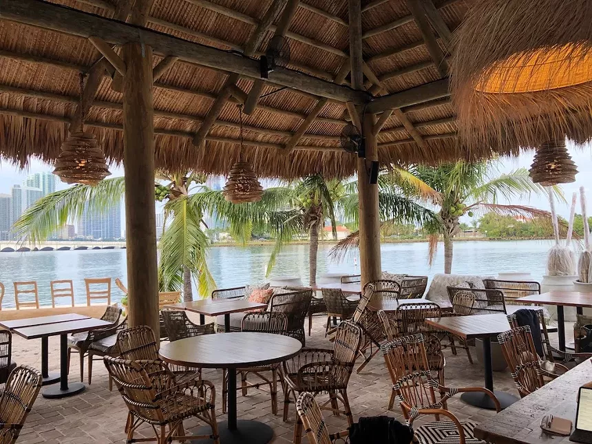 A beach tiki bar overlooking the water