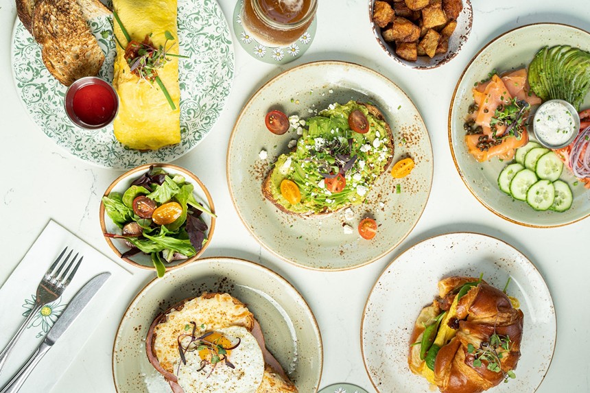 An array of breakfast dishes on plates
