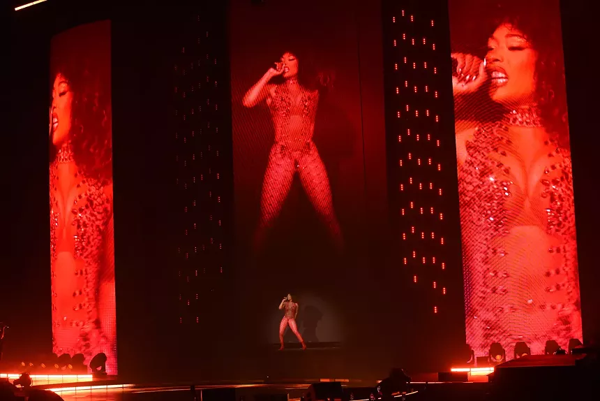 Megan Thee Stallion's image on three enormous LED screens on stage