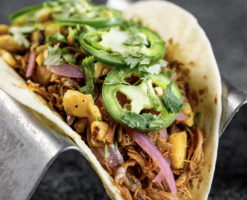 a taco with toppings