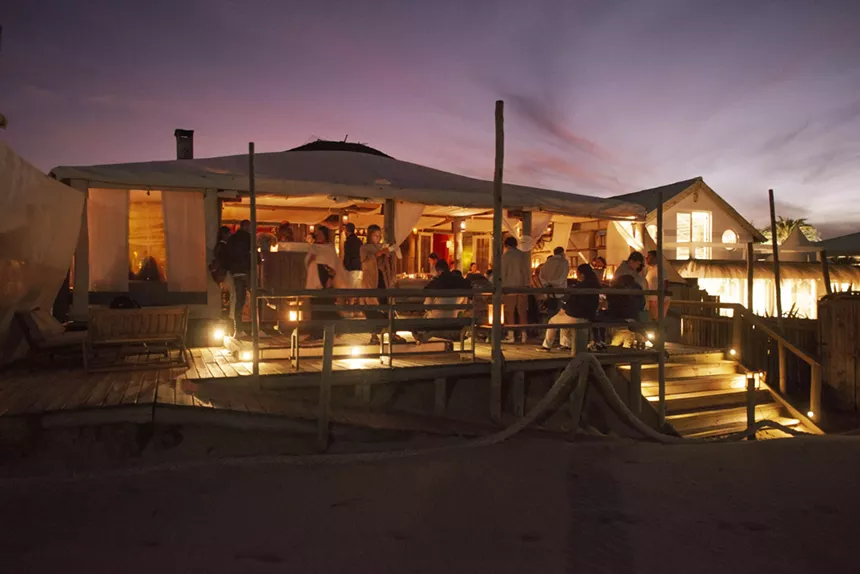 An outdoor dining area with lights