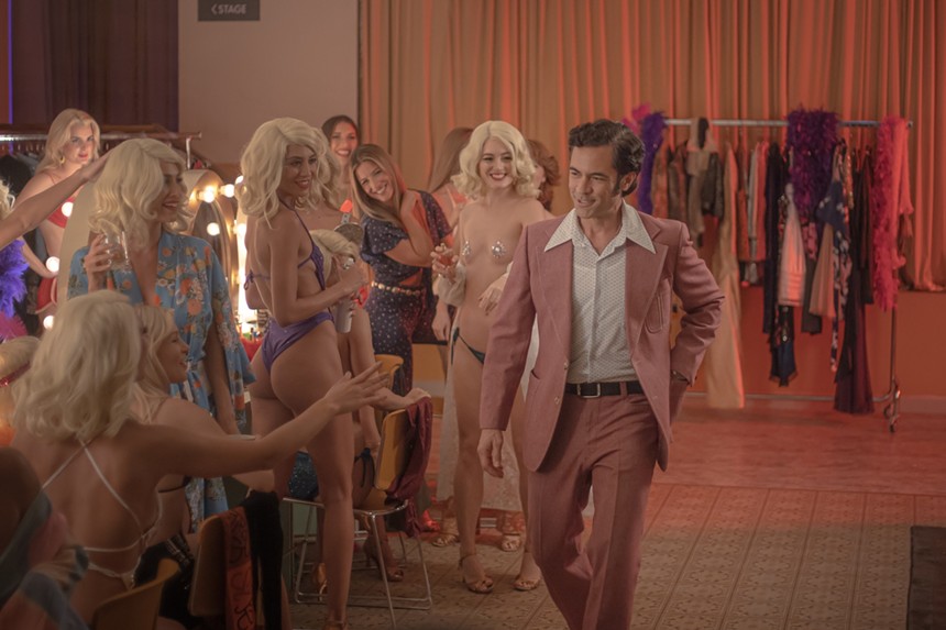 Still of Danny Pino and several women in Hotel Cocaine
