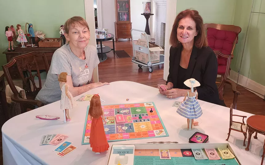 Constance Ruppender and Leslie Schroeder seated at a table