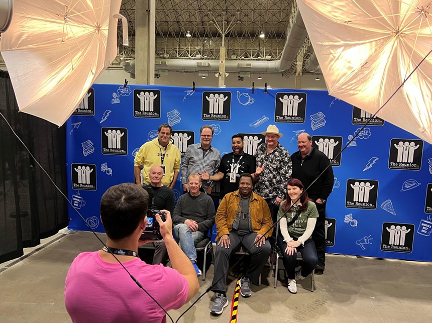 Cast members of The Office pose for a photo