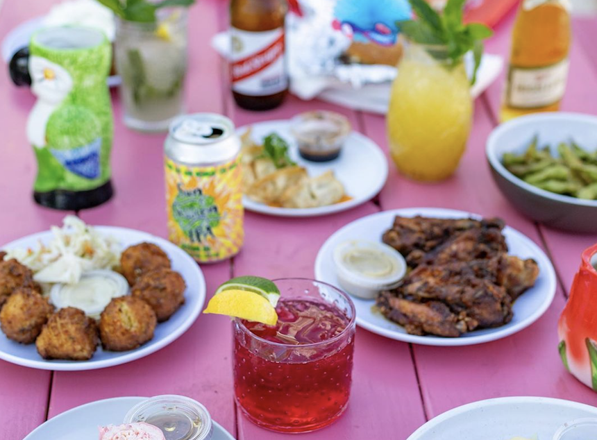 drinks and food on a pink table