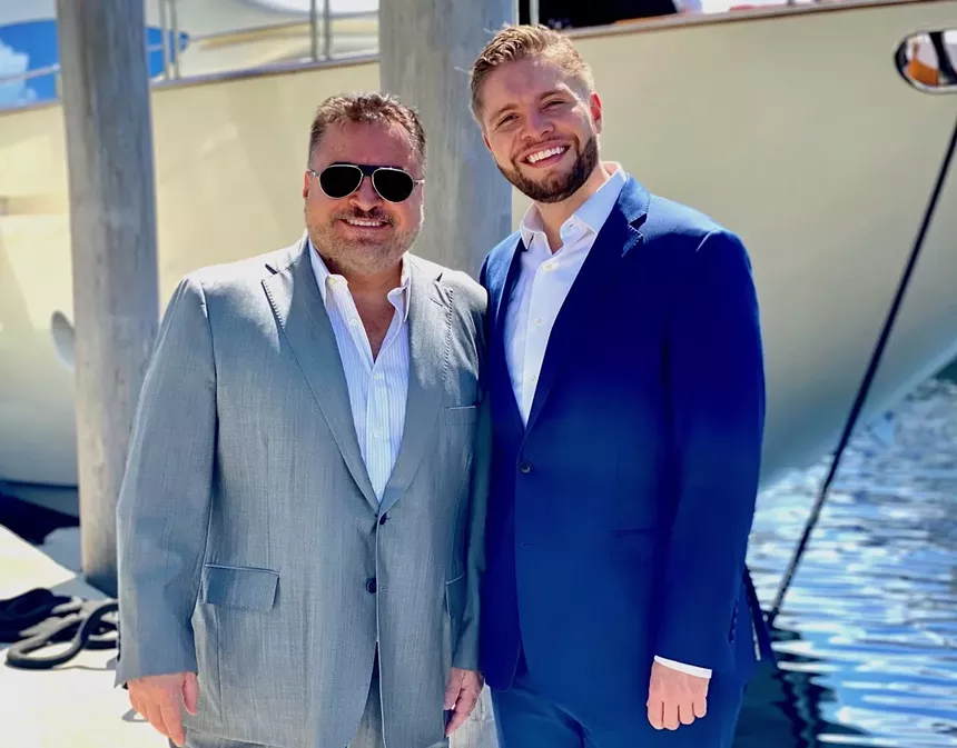two men posing for a photo