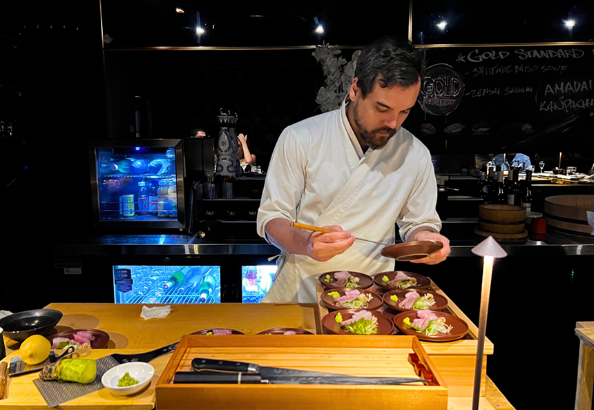 a man making sushi