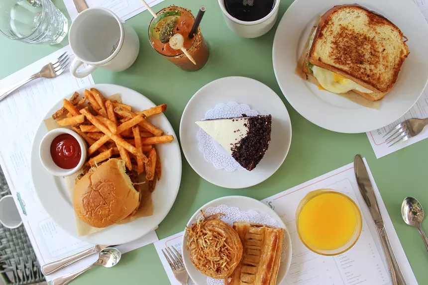 an assortment of dishes on a green table