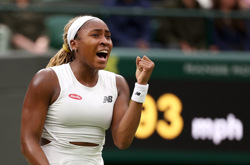 Coco Gauff raises her fist after Wimbledon victory