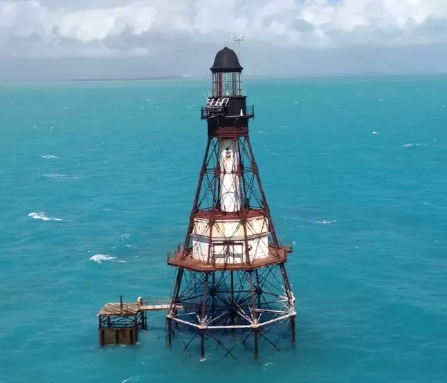 Remote lighthouse several miles offshore of Florida in the Atlantic ocean
