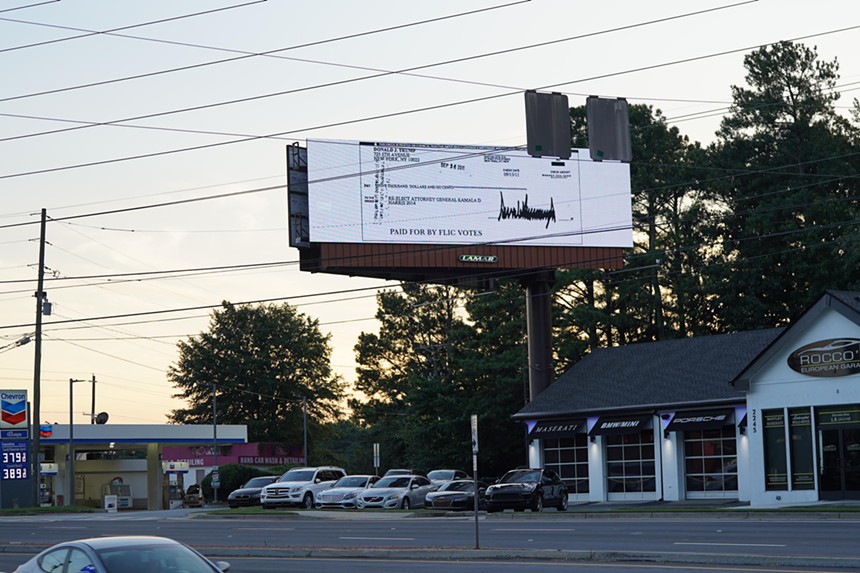 billboard with image of Trump's donation to Kamala Harris' California attorney general re-election campaign.