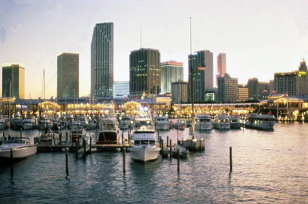 color photo of downtown miami at dusk, looking southwest at Miamarina at Bayside and the skyline.