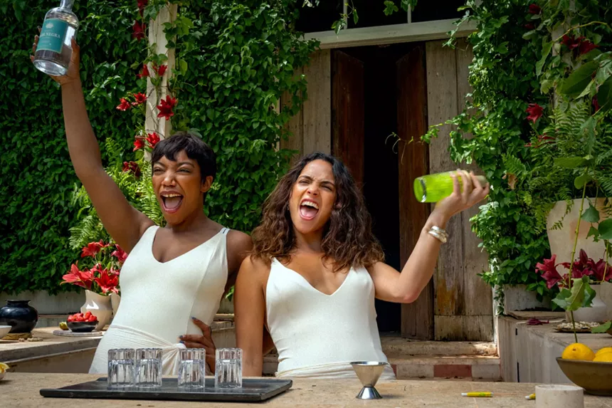 Still of Naomi Ackie and Adria Arjona in Blink Twice