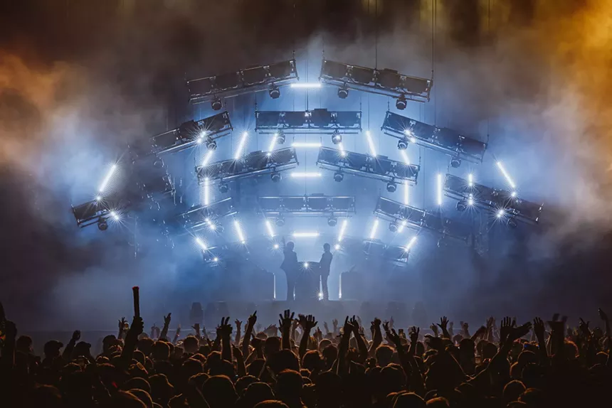 Justice performing on stage at Coachella 2024 surrounded by lights