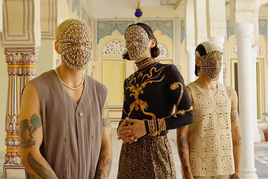 Portrait of the members of Glass Beams wearing masks