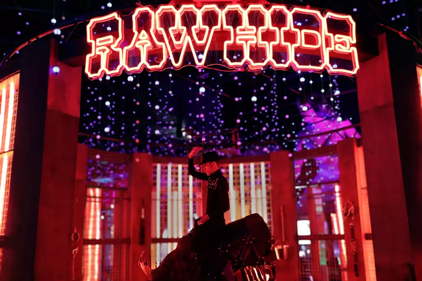A man riding a mechanical bull