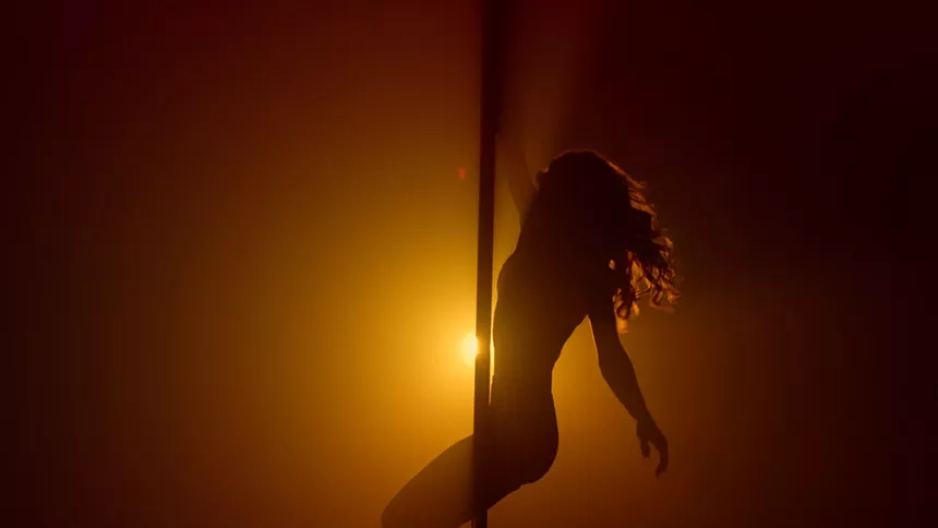 a woman on a stripper pole