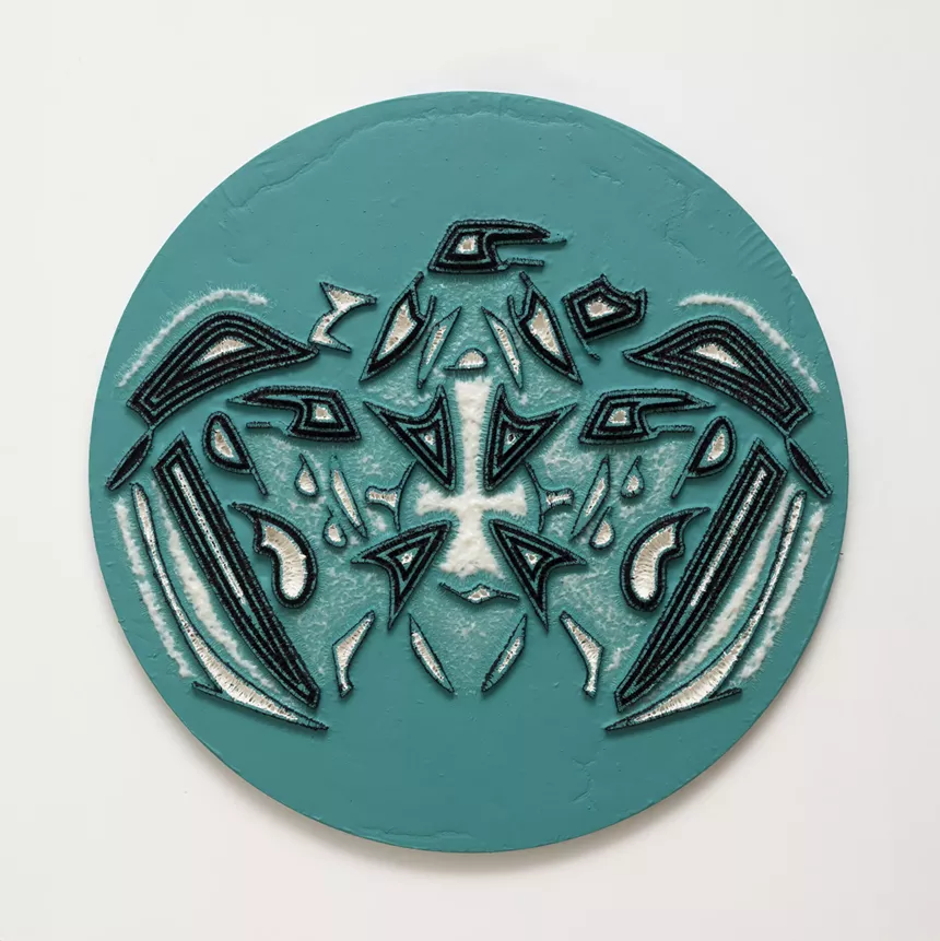 a blue circular piece of art